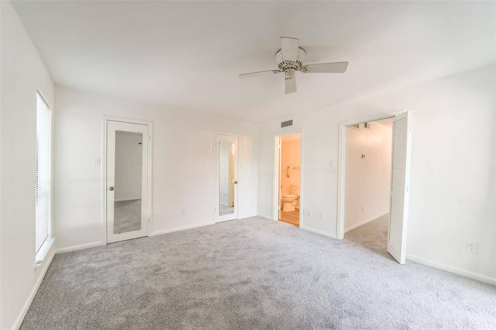 The bedroom features brand-new carpet and fresh paint for a clean, modern feel.