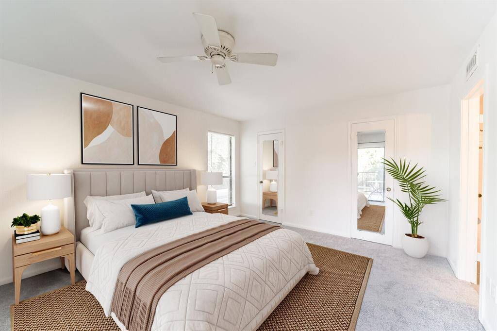 Spacious and inviting primary bedroom featuring a generous walk-in closet.