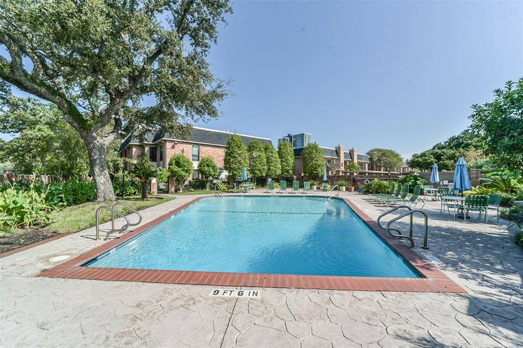 Beautiful and serene pool nestled within a relaxing complex.