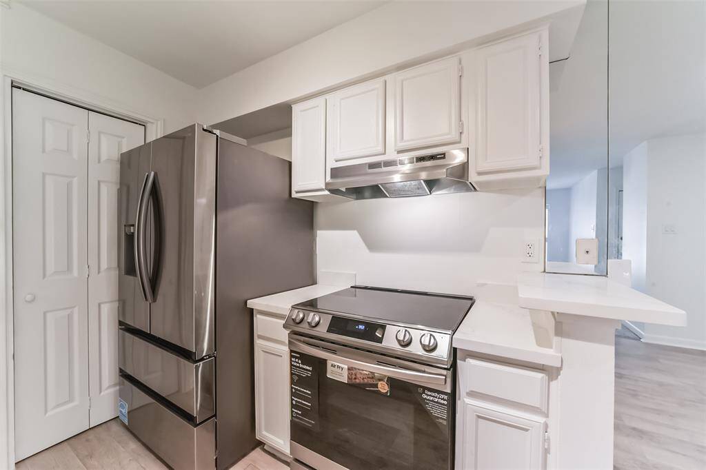 Full-size, brand-new refrigerator and stove.