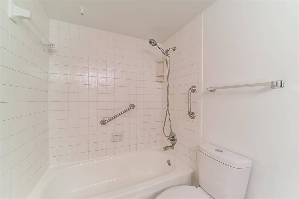 Freshly painted bathroom featuring a brand-new toilet.