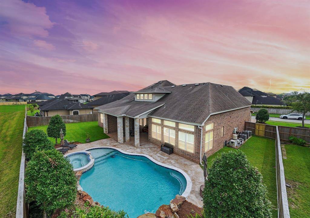 Unwind in your backyard oasis with a heated saltwater pool and hot spa, both illuminated by energy-efficient IntelliBrite 5G Color LED Lights. These advanced LED lights provide vibrant, customizable colors and superior efficiency, ensuring long-lasting performance while enhancing the ambiance of your outdoor space. Private gated community. No one behind you ever! Open the gate and take a walk to the lake.