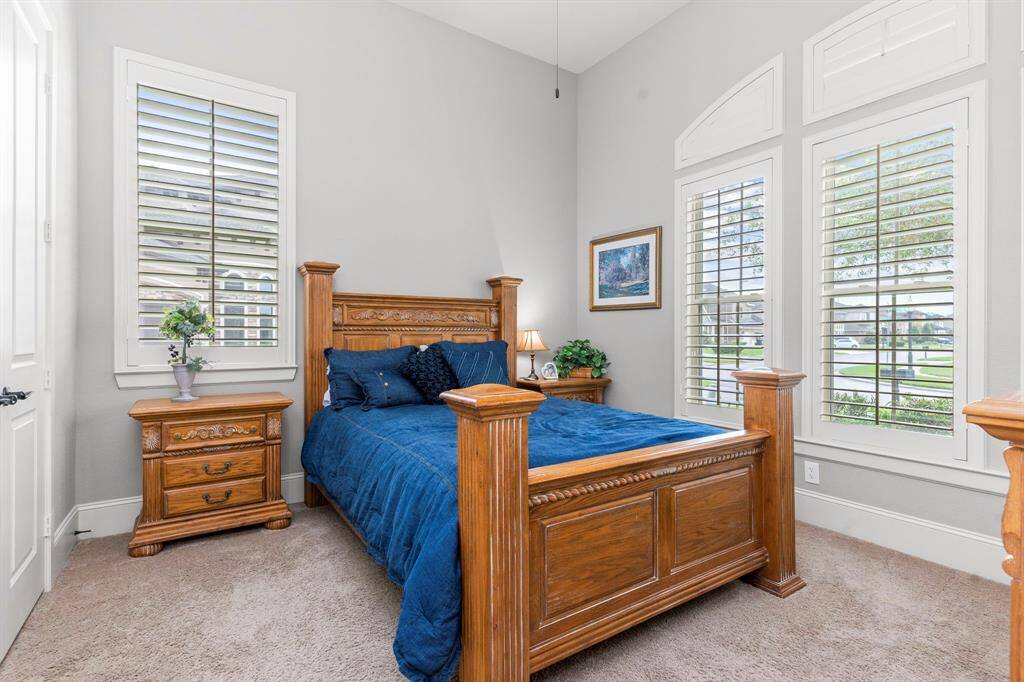 The downstairs suite features soaring high ceilings, a ceiling fan, a huge walk-in closet, and so much more for ultimate comfort and style!  This Guest Suite downstairs great for that parent or little one to be on the first floor with you!