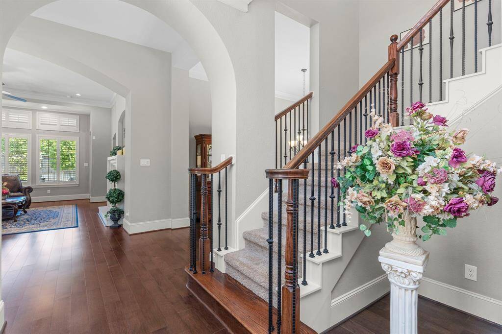 This home has such a timeless design!  Grand entrance looking out to the tropical private backyard