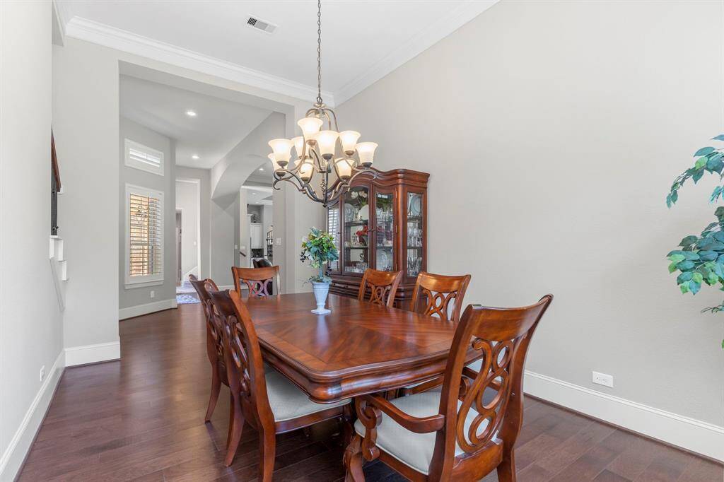 Notice the gorgeous wood floors guiding you through the main areas of this home, where you'll find nearly everything you need for comfort and style!