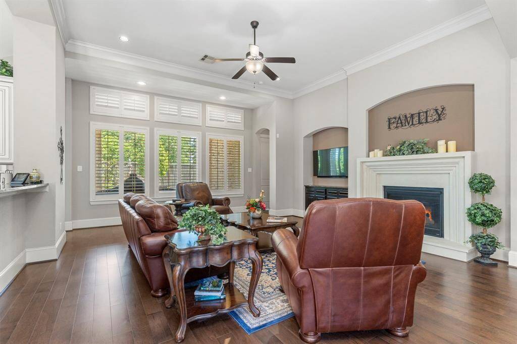 The primary suite boasts breathtaking high coffered ceilings, elegantly trimmed with crown molding. This private owner’s retreat features its own dedicated A/C and heating unit, ensuring the perfect climate control for your ultimate comfort.