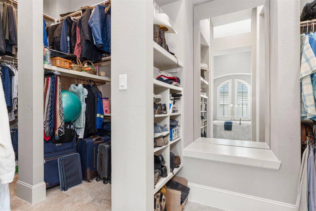 This outstanding his and her walk-in closet is truly incredible! On the right side, you’ll find a huge walk-in closet, while the left side features another massive walk-in closet. With around 150 square feet of storage space, there’s plenty of room to keep everything organized and within reach. Don’t wait—make that appointment today so I can show you this amazing space!