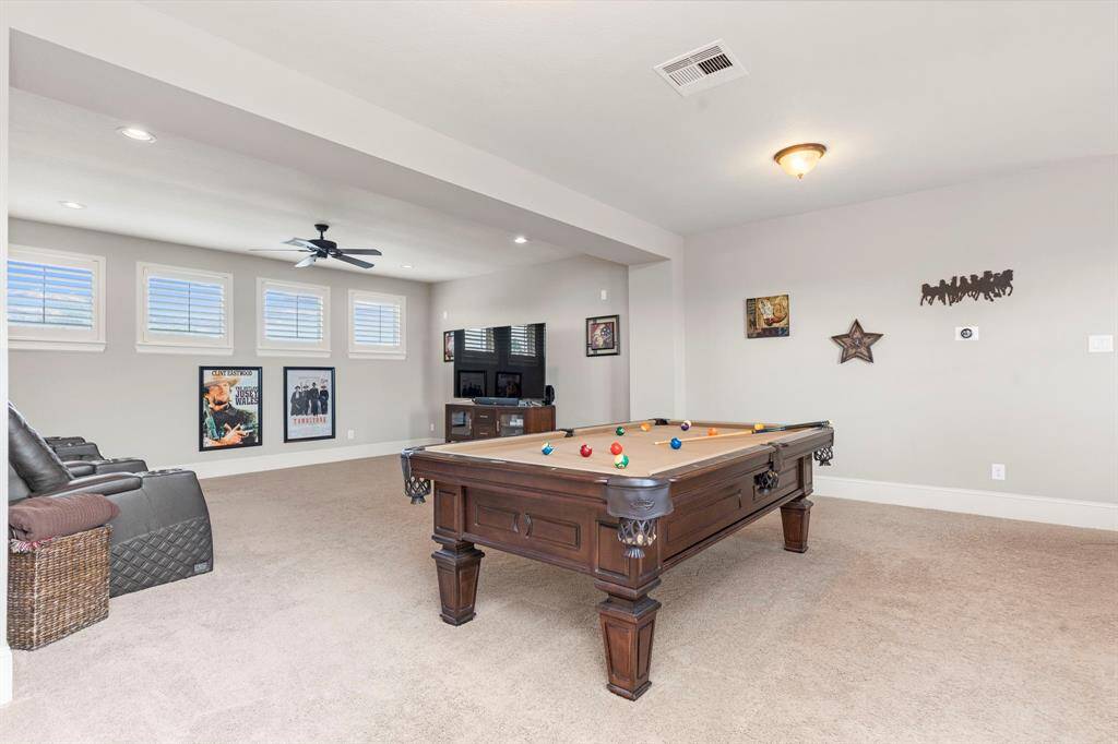 Down the hallway, you'll find the game room and media room—perfect spaces for endless fun and entertainment with family and friends!