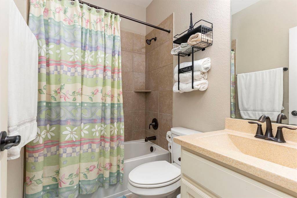 Upstairs features three full bathrooms, offering plenty of convenience and space for everyone in the household!