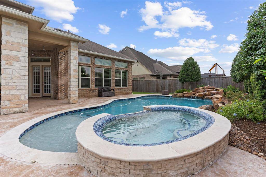 Unwind in the soothing hot tub as you listen to the tranquil melody of the waterfall or bask in the sun while lounging at the pool’s sunny edge for ultimate relaxation. No neighbors behind you a total private lot to enjoy your private time in your backyard!
