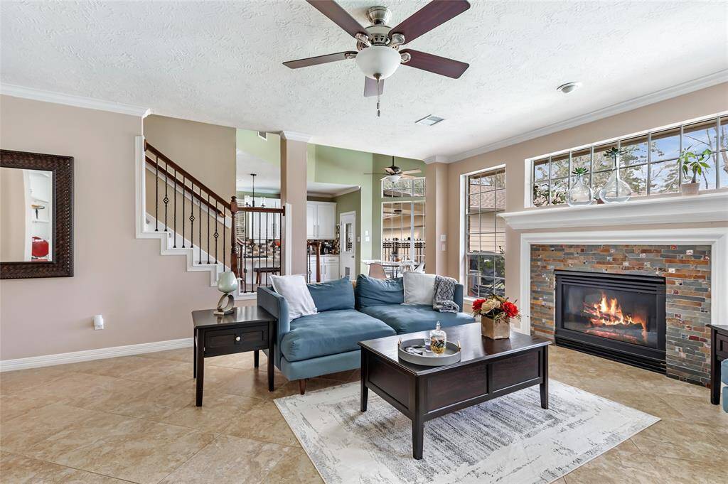 Very cozy and charming family room. Gas log fireplace and tile flooring in here. Great back yard views as well.