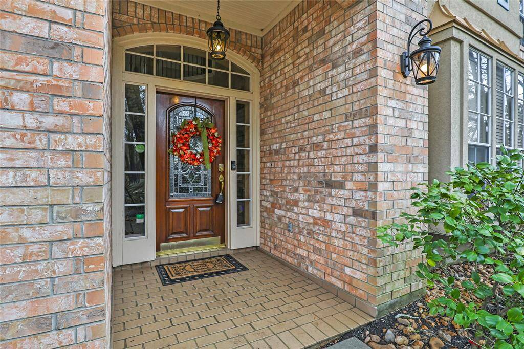 Welcoming brick covered front porch.