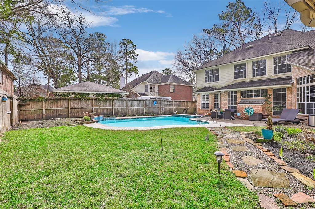 Rear property view -- lots of green grass for the fur babies and kids to play.