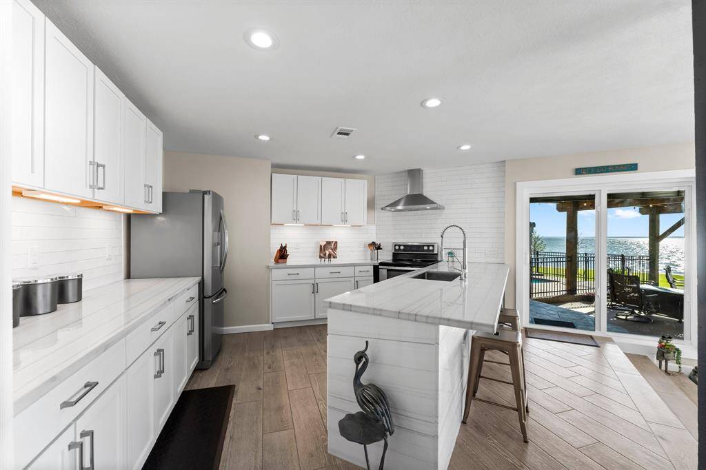 Brand new kitchen features stainless appliances and quartz counters