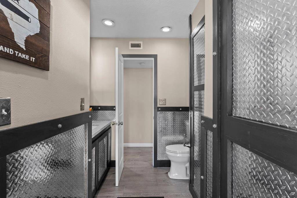 Second bath downstairs, also a washer/dryer space