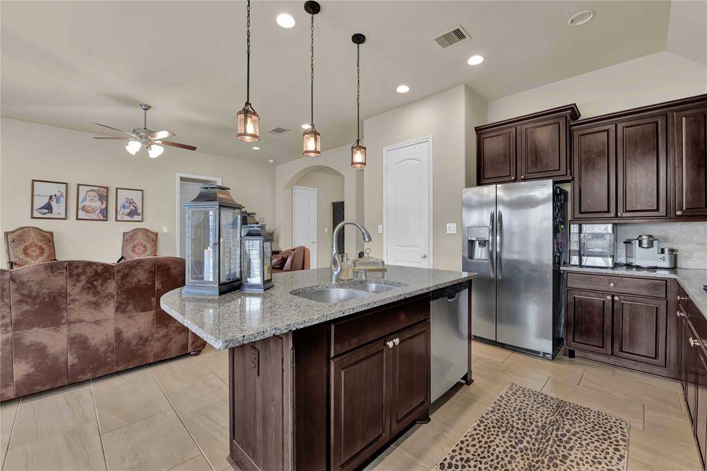 A spacious walk-in pantry is an invaluable feature, providing ample storage for all your kitchen essentials, from dry goods to small appliances. The generous amount of cabinets and drawers not only ensures that everything has its place but also keeps the kitchen organized and clutter-free.