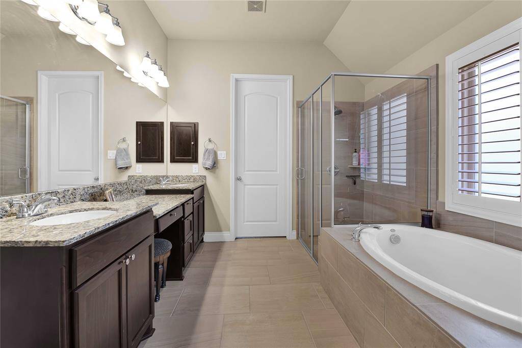 This ensuite bathroom elevates your daily rituals to a new level of luxury and serenity, transforming everyday routines into a pampering experience. With its thoughtful design and high-end finishes, each element invites relaxation and tranquility