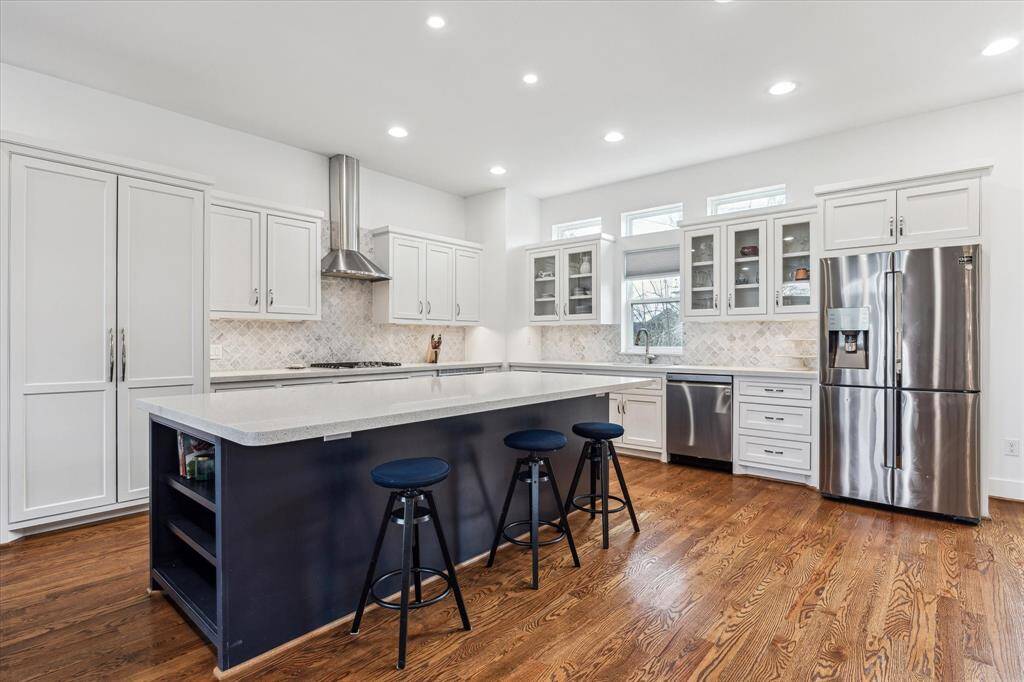 You can comfortably seat 3-4 people at the island. The appliances are all stainless steel, and include a gas cooktop, single oven, dishwasher and microwave.