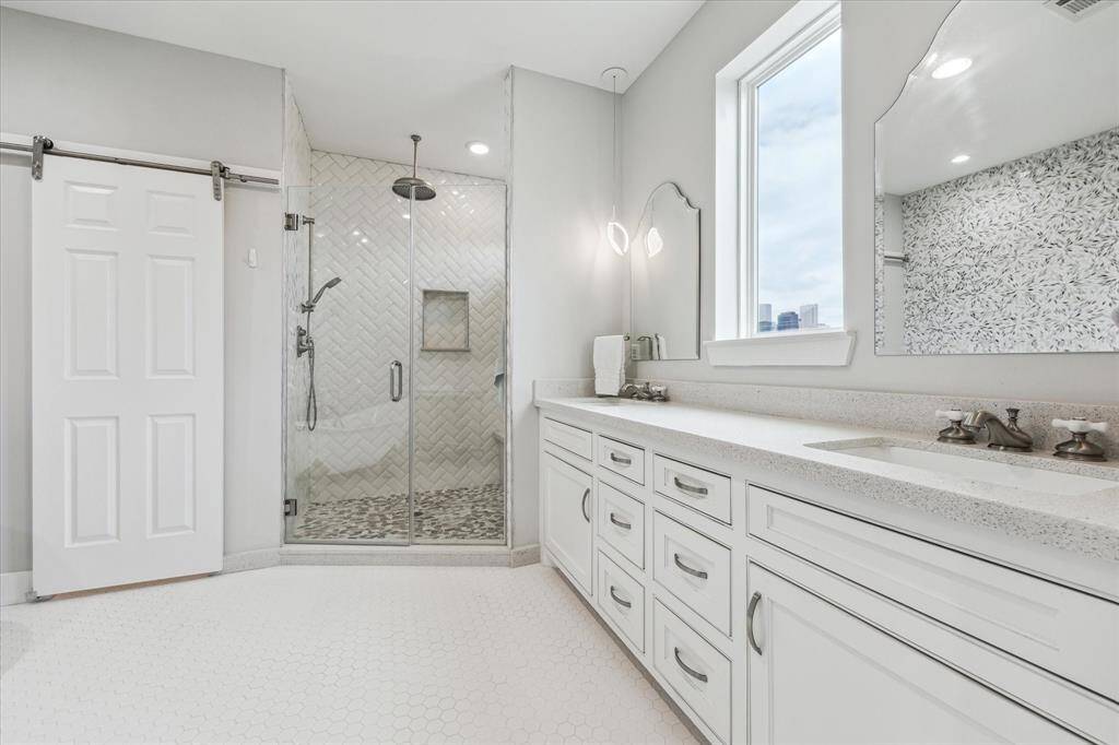 Indulge in spa-like luxury in this stunning master bathroom, where timeless elegance meets modern sophistication.