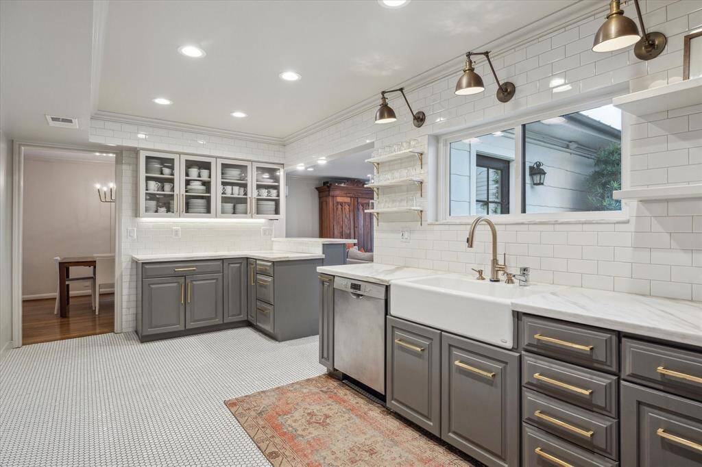 Adorable, renovated Kitchen with cased openings to formal dining room and the family room