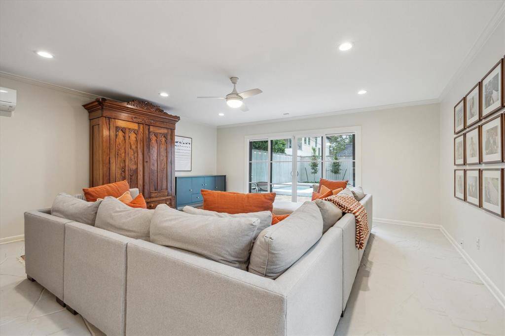 Another view of the family room with huge sliding doors to the backyard and pool