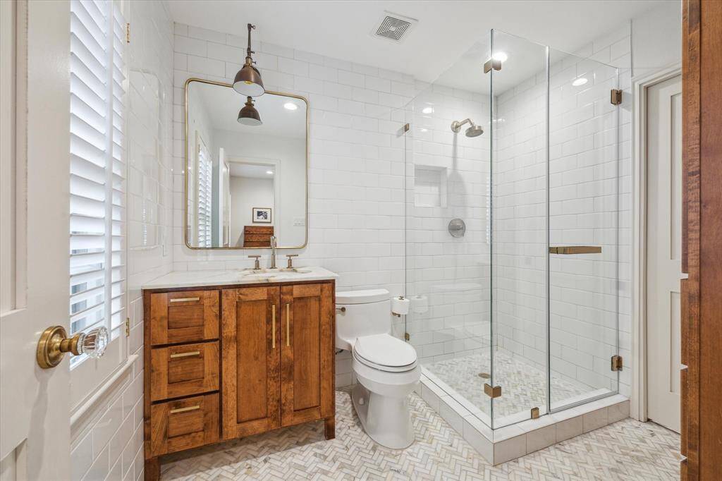 Primary bath with walk-in shower and large closet
