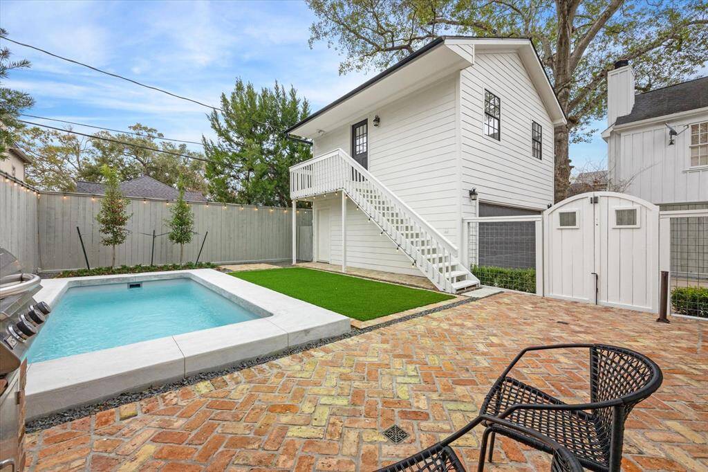 Incredible backyard with pool, brick patio, artificial turf and built-in grill!
