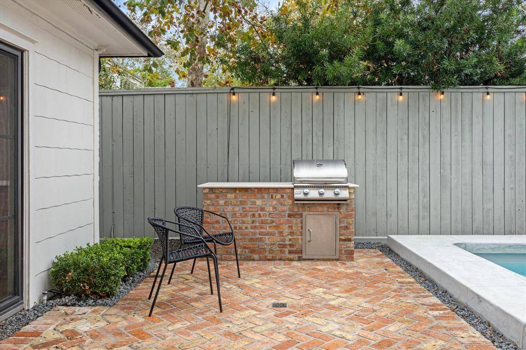 Built-in grill rounds out this lovely outdoor living space