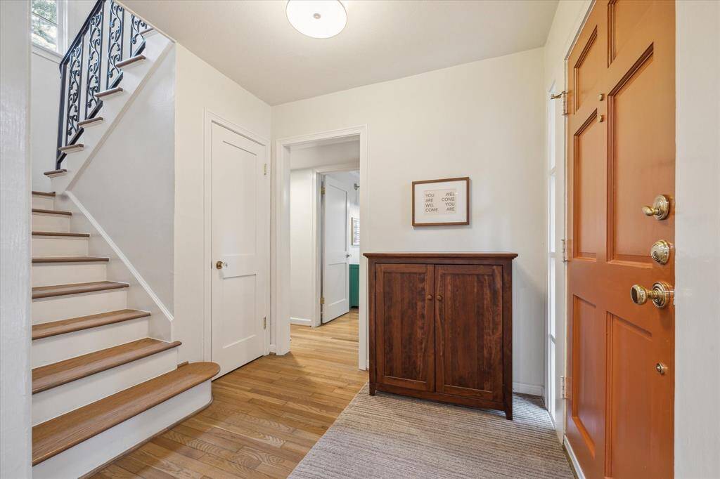 Welcoming entry with hardwood floors and natural light!