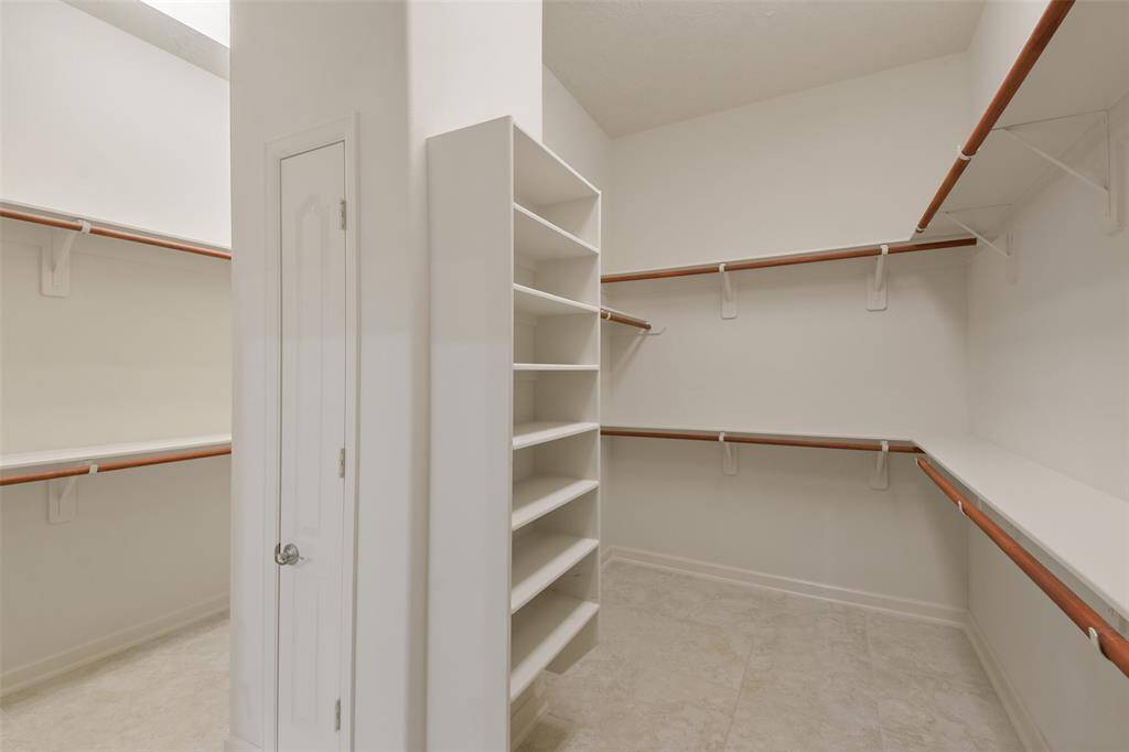 Primary closet with separated areas