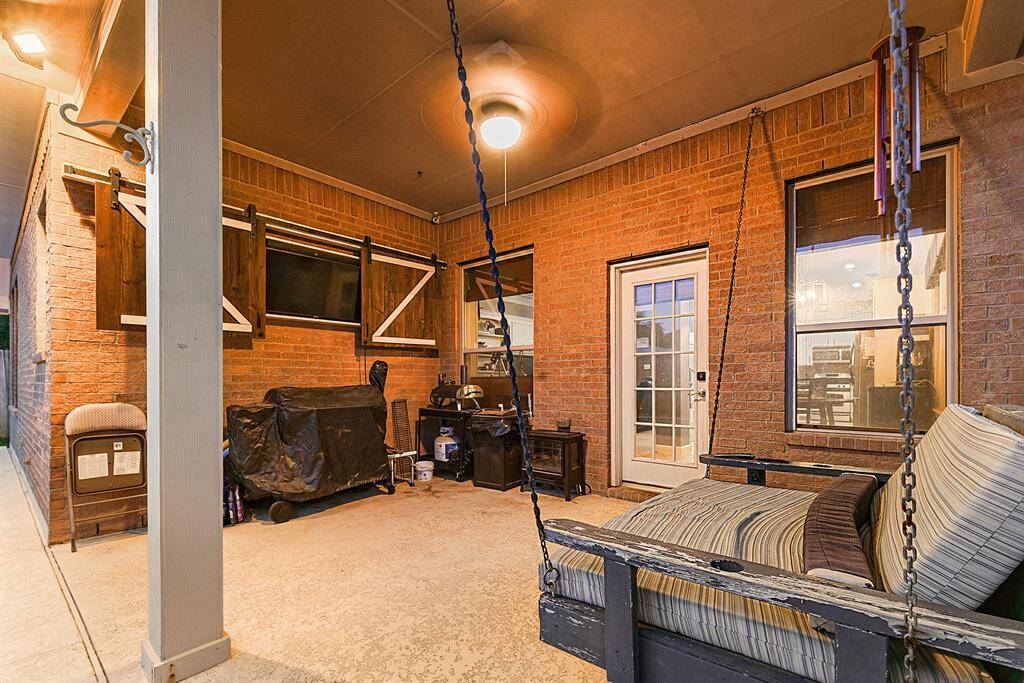 his backyard has plenty of space for entertaining with a oversized coved patio, ceiling fan and recessed lighting. Amazing place to relax and enjoy weekend and evenings. (TV stays with the home. )
