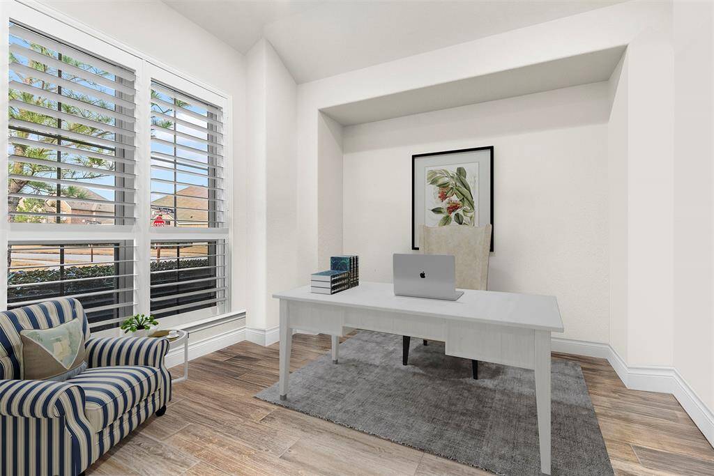 Dedicated study with French doors, plantation shutters and furniture niche.