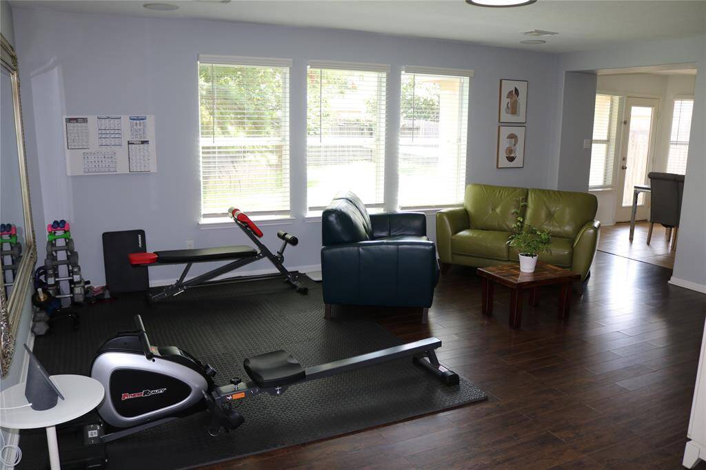 This living room provides the flexibility and comfort you need. The hardwood floors and direct access to other areas of the house make this space both functional and elegant.