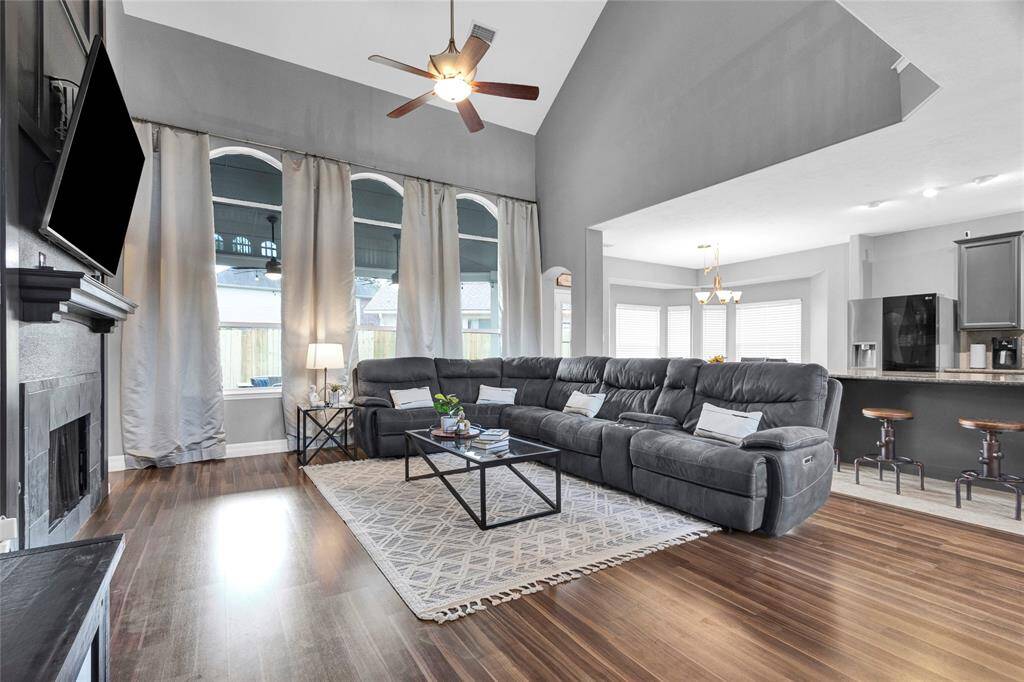 Inviting Den with Vaulted Ceilings and Ample Natural Light