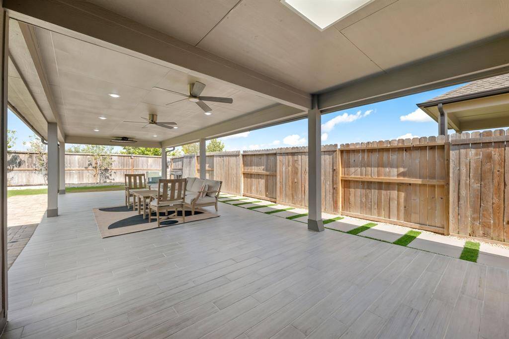 Sit back, relax and enjoy your gorgeous backyard under your large covered patio. Complete with outdoor fans and recessed lighting, plenty of space for an outdoor kitchen or grilling station and outdoor seating. Your covered patio overlooks your huge backyard with plenty of green space for the kids and your furry friends to enjoy.
