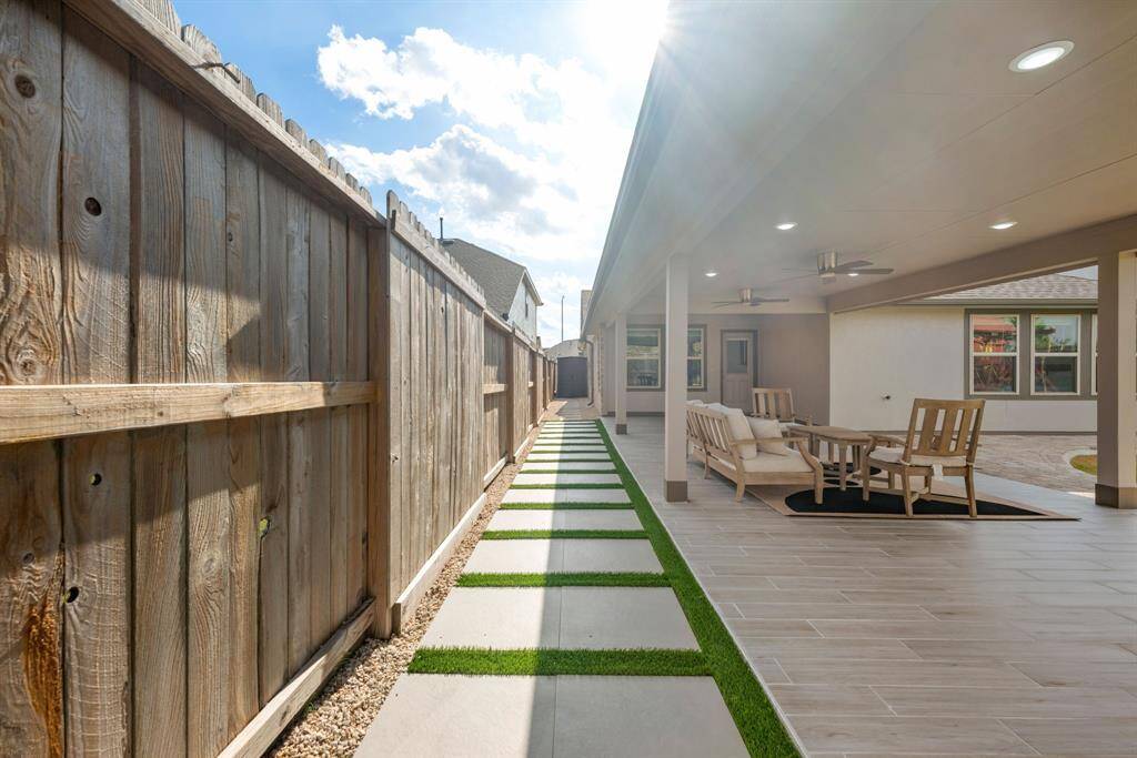 Come and see this spacious backyard with its beautiful covered patio and paved walkway down the side yard. There is plenty of room for the kids to play and adults to relax! Perfect for your outdoor living space, patio furniture, bbq pit, and so much more. The possibilities are endless!