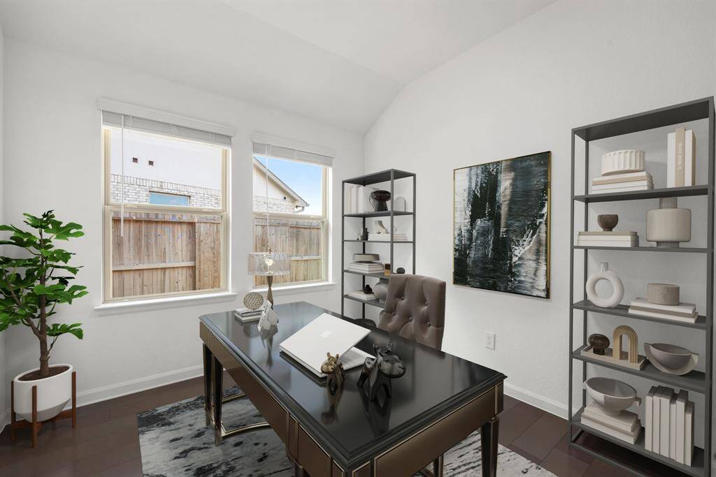 Nestled away quietly in the front of the home is the handsome and grand home office. Featuring high ceilings, neutral paint, tile flooring and large windows with privacy blinds.