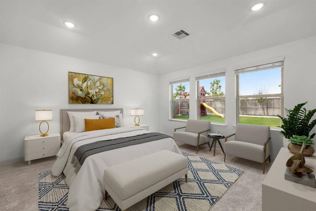 What a wonderful place to come home to! This stunning primary suite greets you with plush carpet floors, neutral paint, high ceiling, recessed lighting, large windows with blinds allowing in natural light brightening up this spacious primary bedroom with extra space for a seating area.