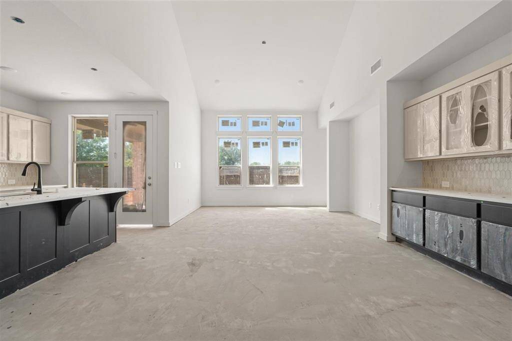 Enjoy meals in the comfortable dining space with built- in charm and a view of the heart of the home.