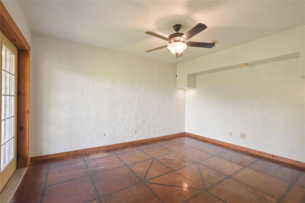 Off of the gameroom area is this home office with views out to the expansive yard.