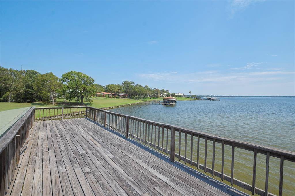 Atop the boathouse is this wonderful sun deck which may also be set up for outdoor entertaining lakeside!