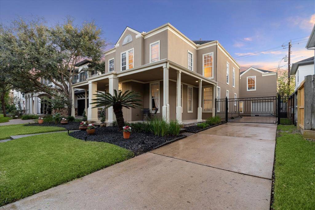 The iron driveway gate is a great feature of the home.