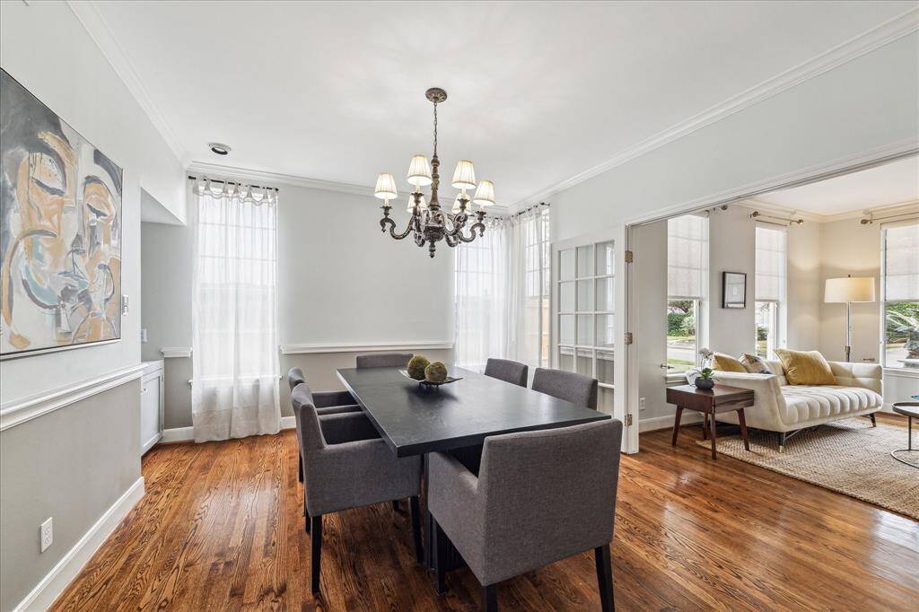A tasteful chandelier and pretty molding accent the formal dining room.