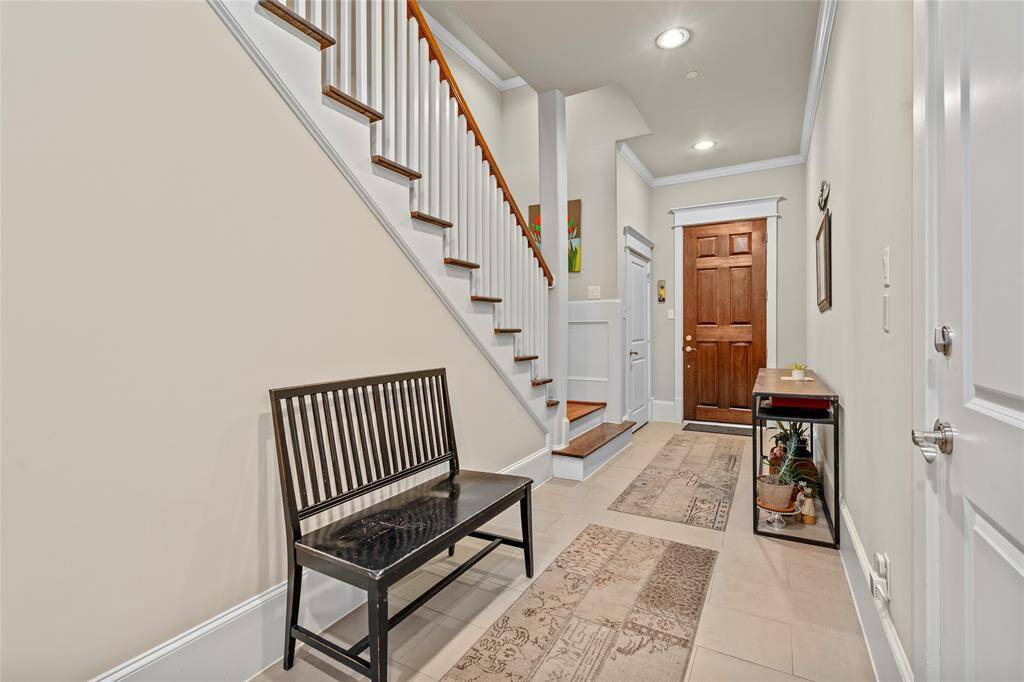 The wide entry hall welcomes you into the home.