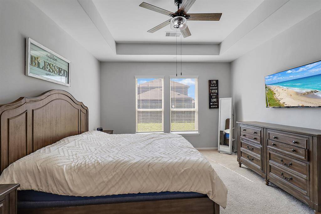 Another view of primary bedroom