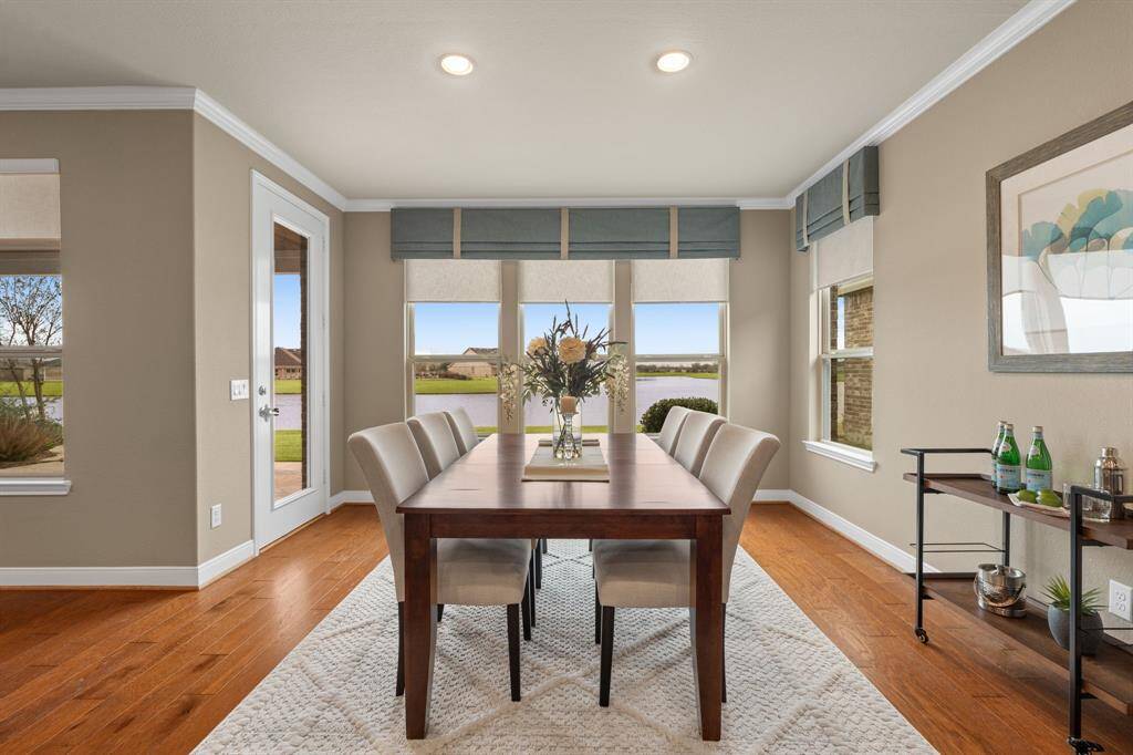 The dining area can fit a table that seats 8-10 comfortably, with plenty of wall space for a sideboard.