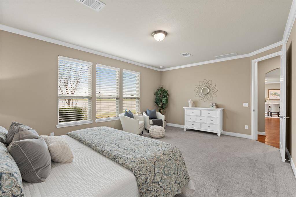 What truly sets this suite apart are the breathtaking, serene water views right from your private backyard retreat. Adding to its distinction, the 8-foot doors enhance the sense of space and luxury—an exclusive feature found only in homes built in 2015 or later.
