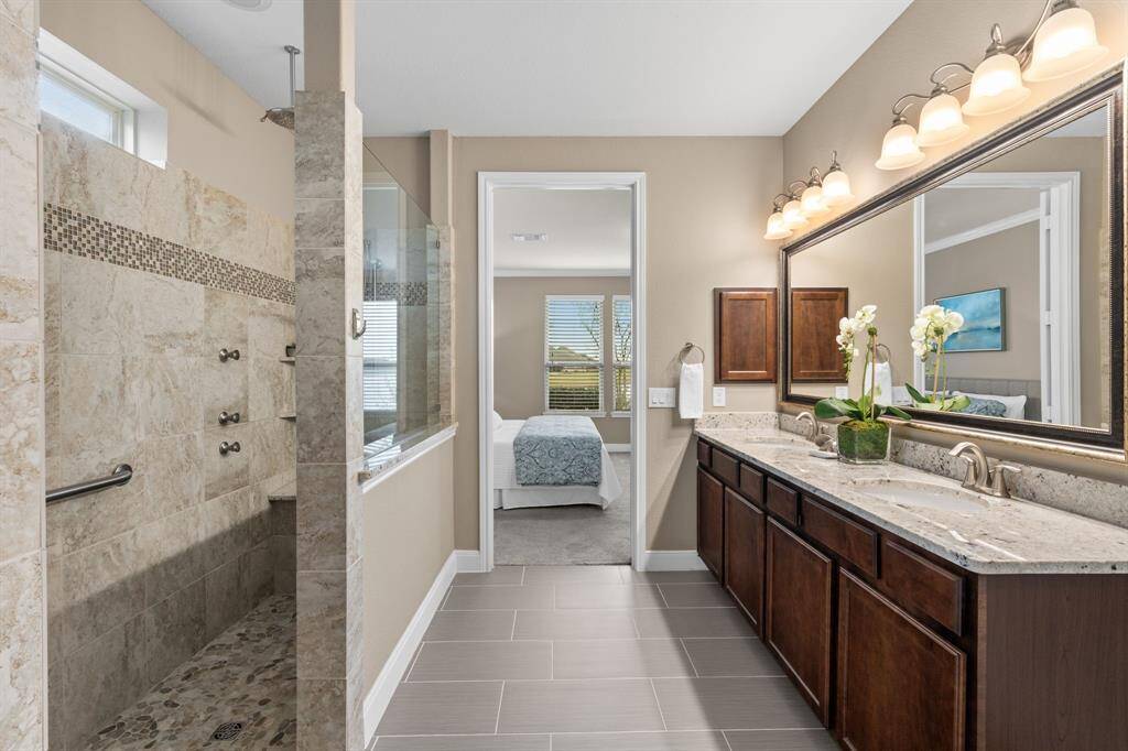 The spa shower, a marvel of modern design and functionality. It boasts multiple shower features, including body jets that provide a soothing and invigorating massage, a rain shower head that envelops you in a cascade of relaxation, and a convenient hand-held shower for customized comfort.