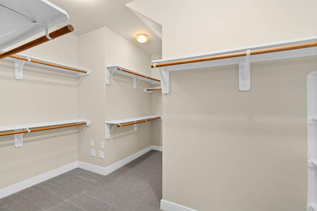 An expansive walk-in closet offering plenty of storage space.
