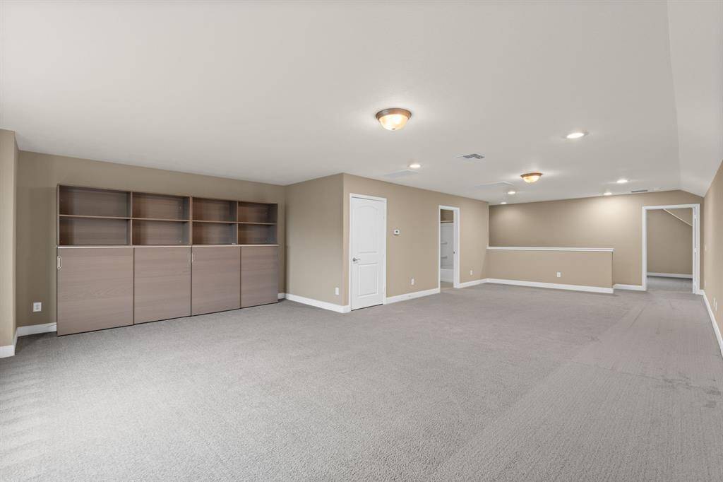 Unleash your creativity with tremendous wall space in the loft, perfect for showcasing an entertainment center or displaying artwork. Let your imagination run wild – the possibilities are truly endless in this versatile and inviting space. HVAC is in a closet on left - to change an air-filter, no standing on a ladder! The open door on the left is a full bath.